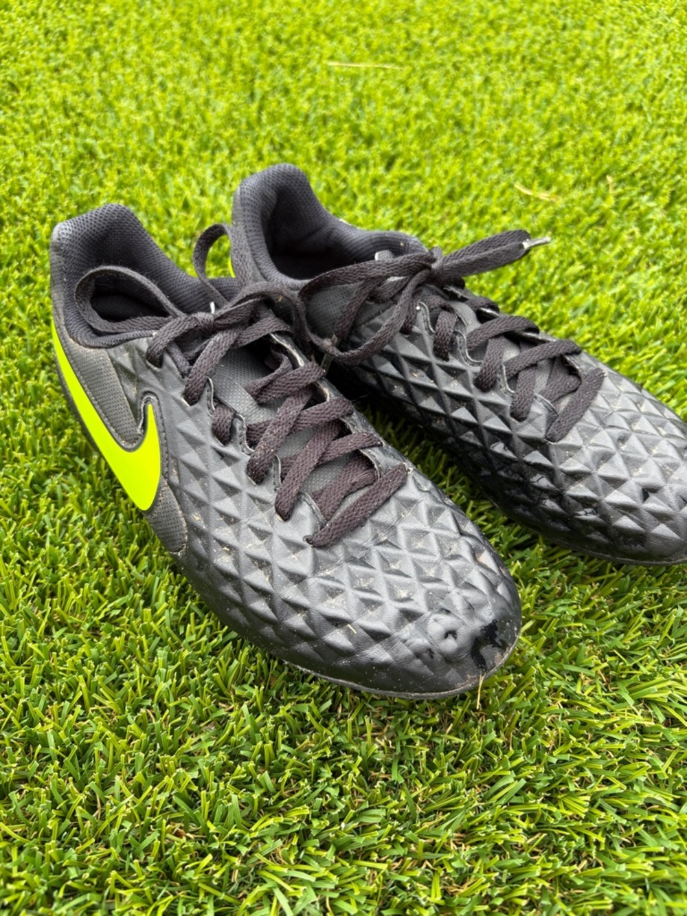 Nike Kids Black Soccer Shoes with Neon Yellow Swoosh